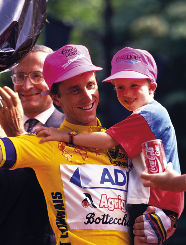 Greg LeMond on the winner's podium, with his son