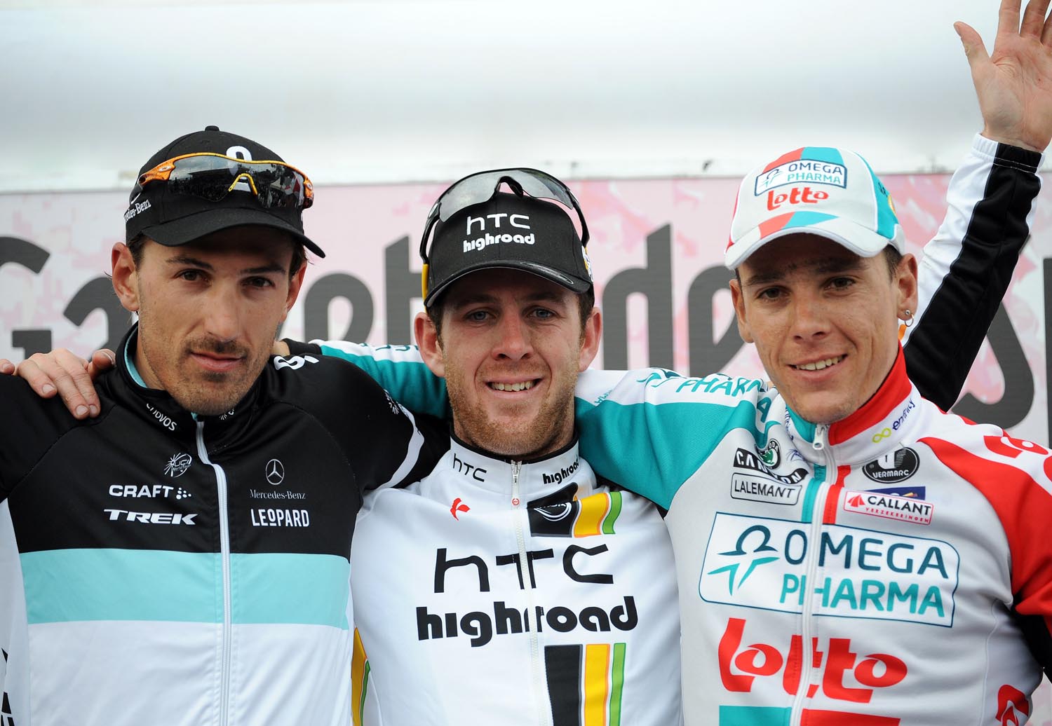 Matt Goss tops podium, flanked by Fabian Cancellara (second) and Philippe Gilbert (third), Milan-San remo 2011