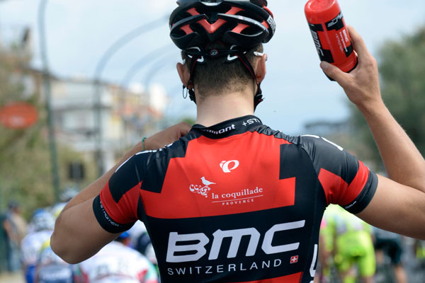 Photo: Taylor Phinney collects bottles, Giro d'Italia 2013. 
