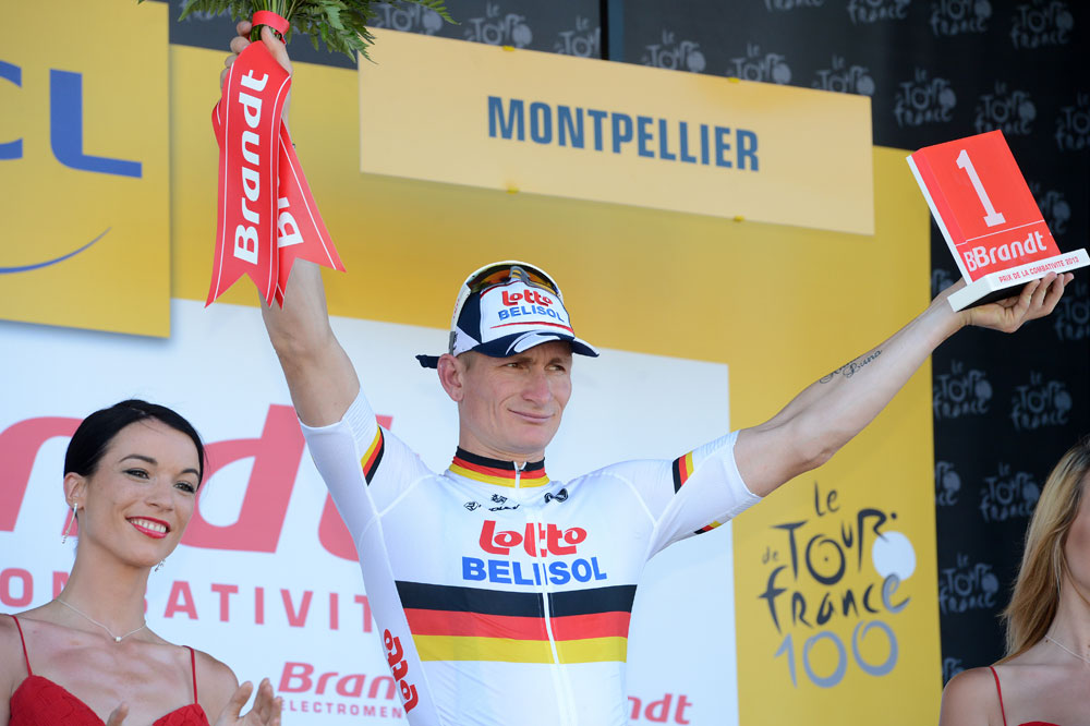 tdf13-st6-aj-Greipel-Brandt-podium.jpg Andre Greipel with Brandt combativity award, Tour de France 2013, stage six