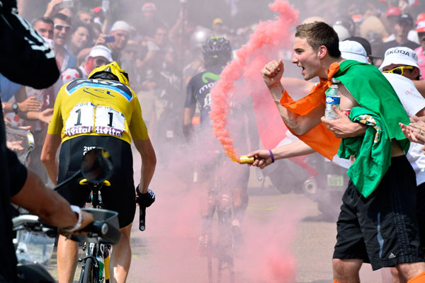 Chris Froome rides past fans on Alpe d'Huez, Tour de France 2013, stage 18 Chris Froome rides past fans on Alpe d'Huez, Tour de France 2013, stage 18